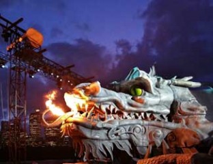 The dragon will stand guard over the stage. measuring 60 m in length and weighing around 4 tonnes it has taken more than 1000 man hours to carve from expanded polystyrene.